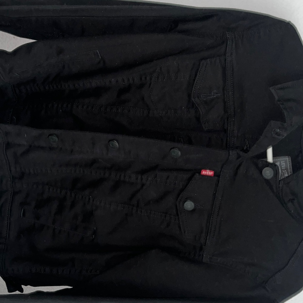 I’m selling a Levi black denim jacket